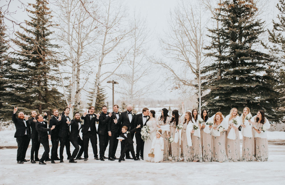 Wedding party outside with snow