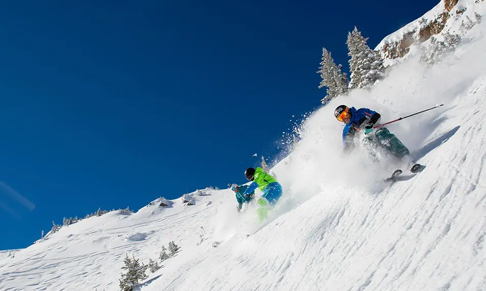 group of skiers shredding hard at snowmass