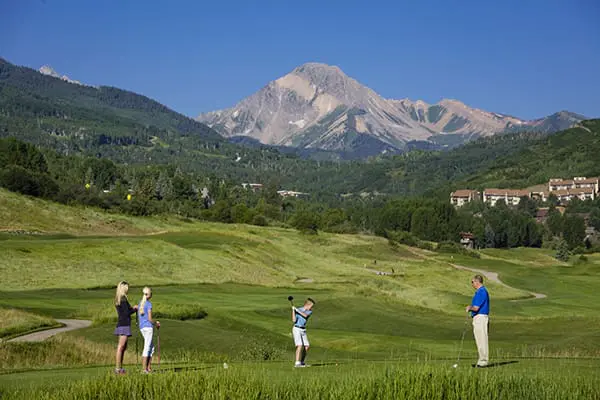 Golfing in Snowmass with Mt. Daly in Background