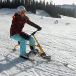 woman on a snowbike