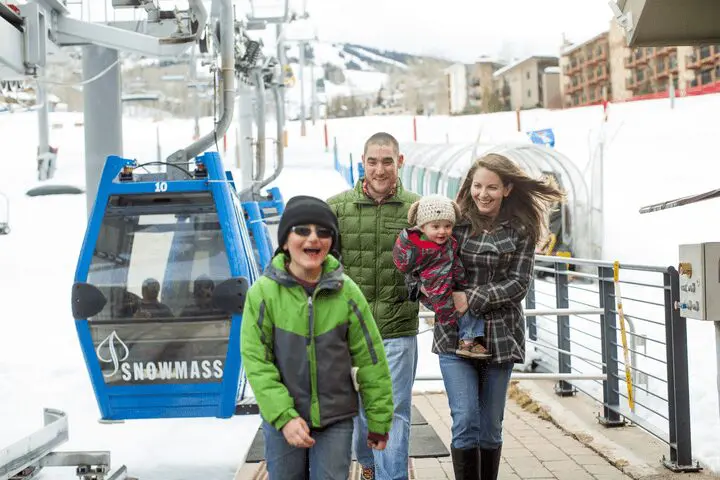 family slopeside at Snowmass Gondola