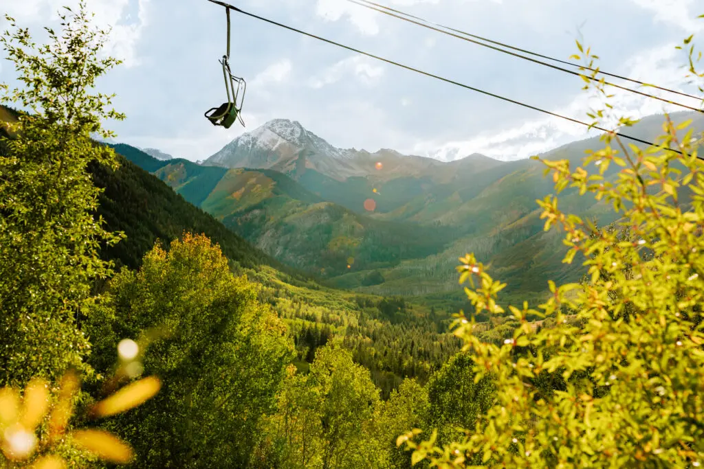 Ditch Trail in early autumn colors with a view of the Campground Chairlift.
