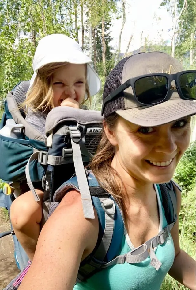 a mom and kid on a hike