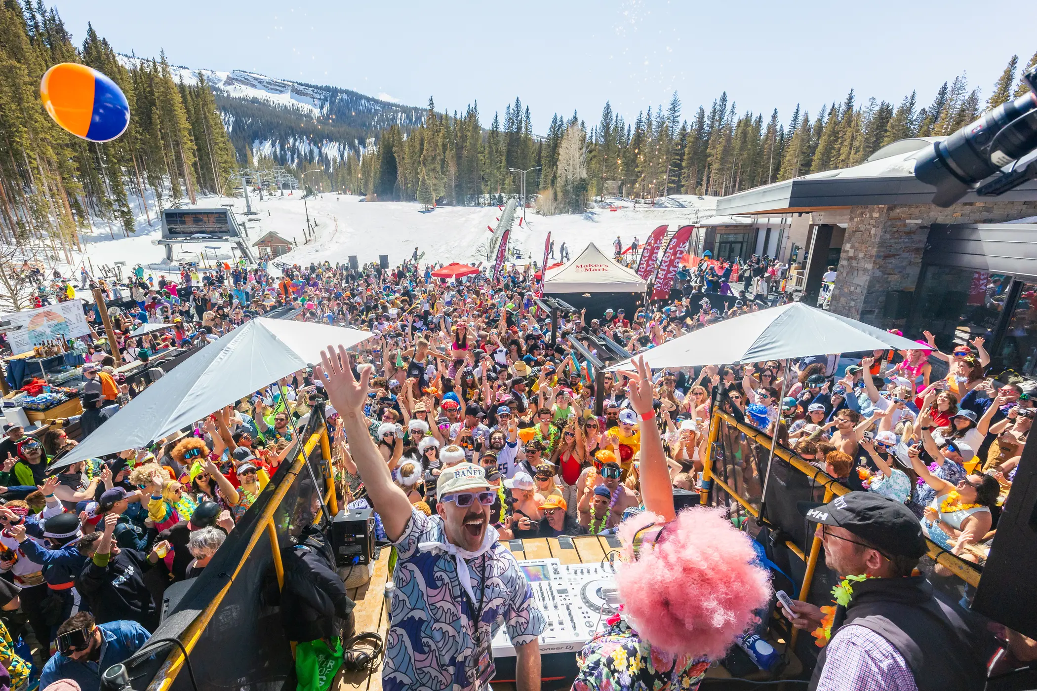 Closing party for the ski season at Elk Camp in Snowmass with bright colors, beach balls, and a DJ.