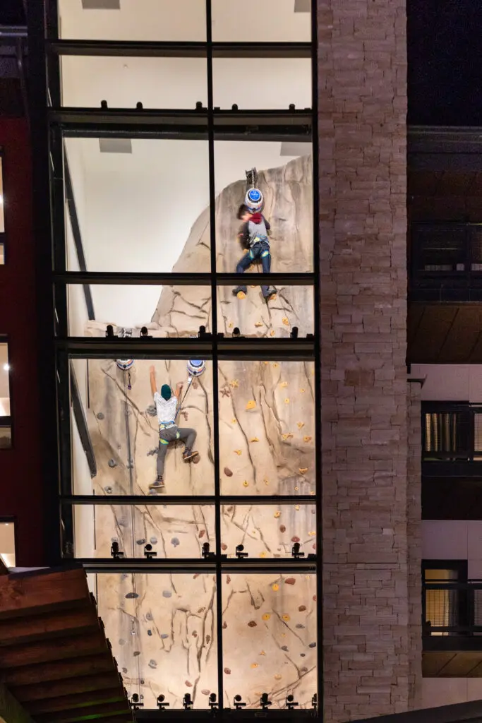 kids on an indoor activity climbing wall near aspen colorado 