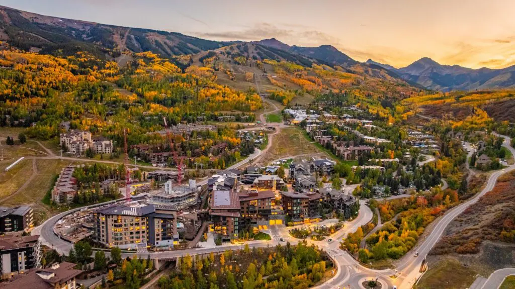 aerial view of lodging accommodations near Aspen in the autumn as the fall foliage changes color to shades of yellow and orange