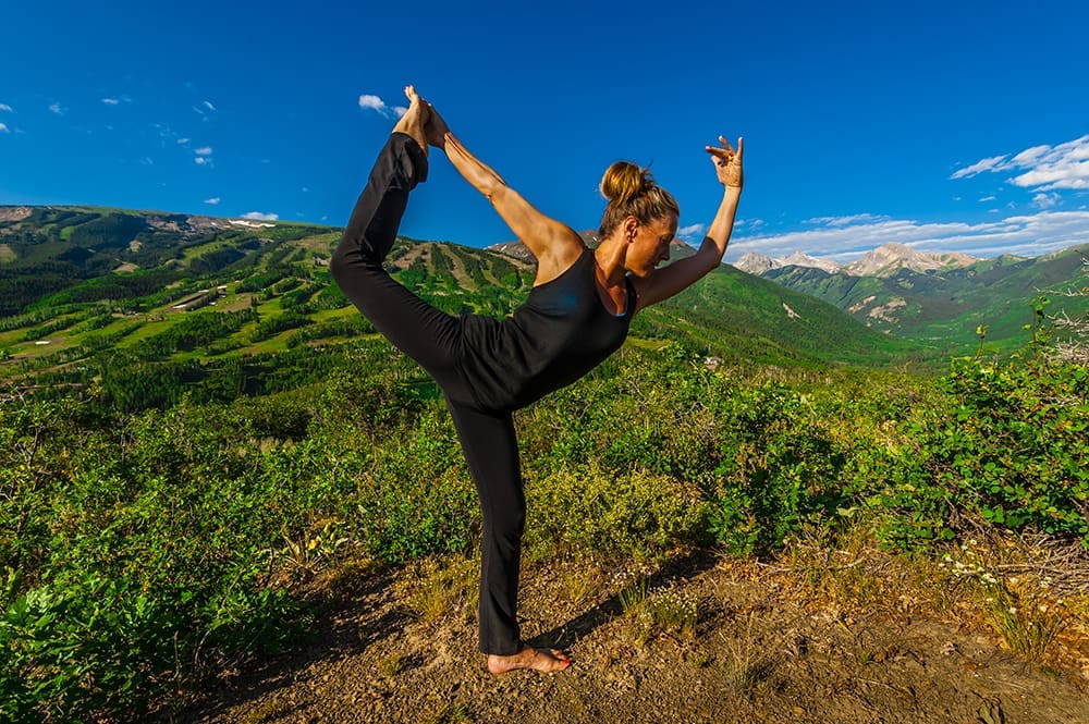 Woman doing yoga, Rim Creek Trail, above Snowmass Village