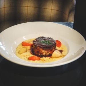 Colorado Lamb on bed of polenta served at the limelight hotel in snowmass colorado