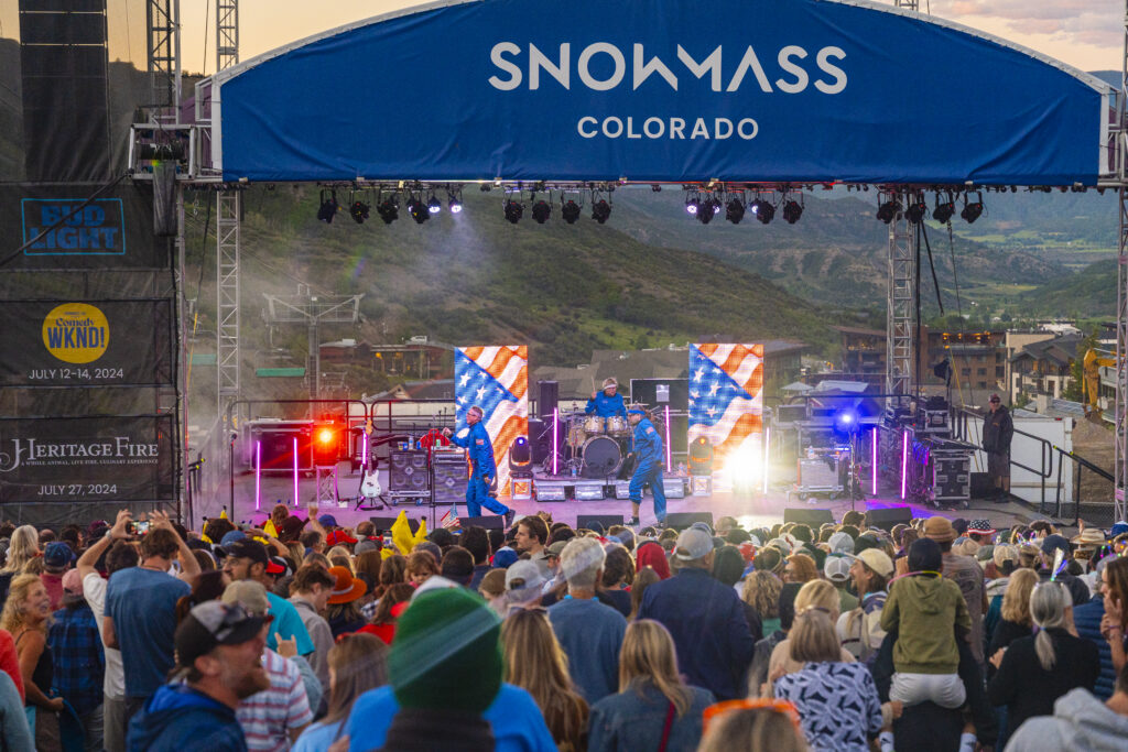 Music in Snowmass with The Spazmatics on the Fanny Hill stage, dressed in 4th of July colors and playing music in front of a dancing crowd.